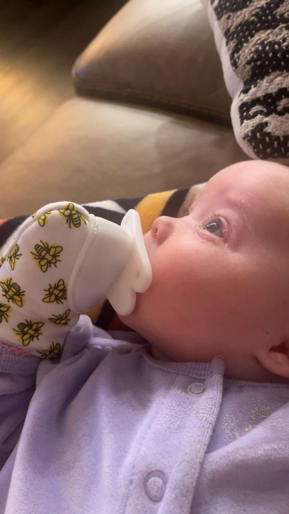 Baby with ThumBee Pacifier Mitten self-soothing